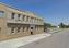 Woodward Ave. Industrial Building with Fenced Lot: 20 Bartlett St, Highland Park, MI 48203